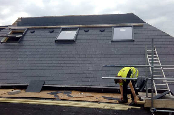 Roofer installing a new roof